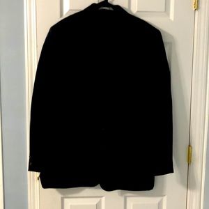 Navy blue jacket split in the back two pockets in front two buttons in the front